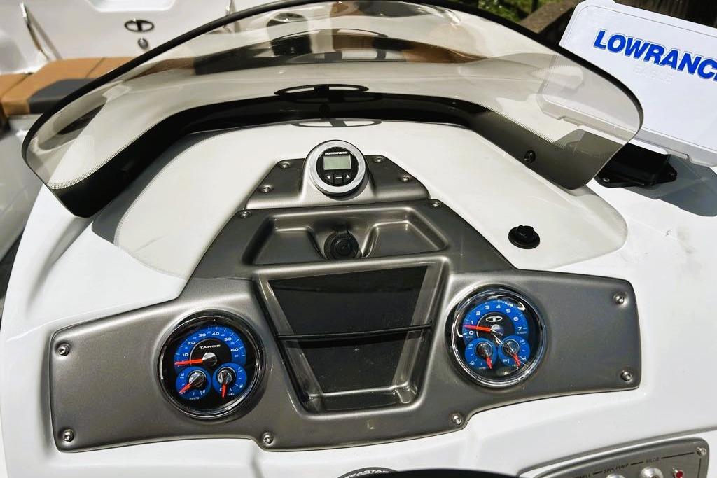 Dashboard of 2026 Tahoe 2150 boat with gauges and Lowrance equipment.