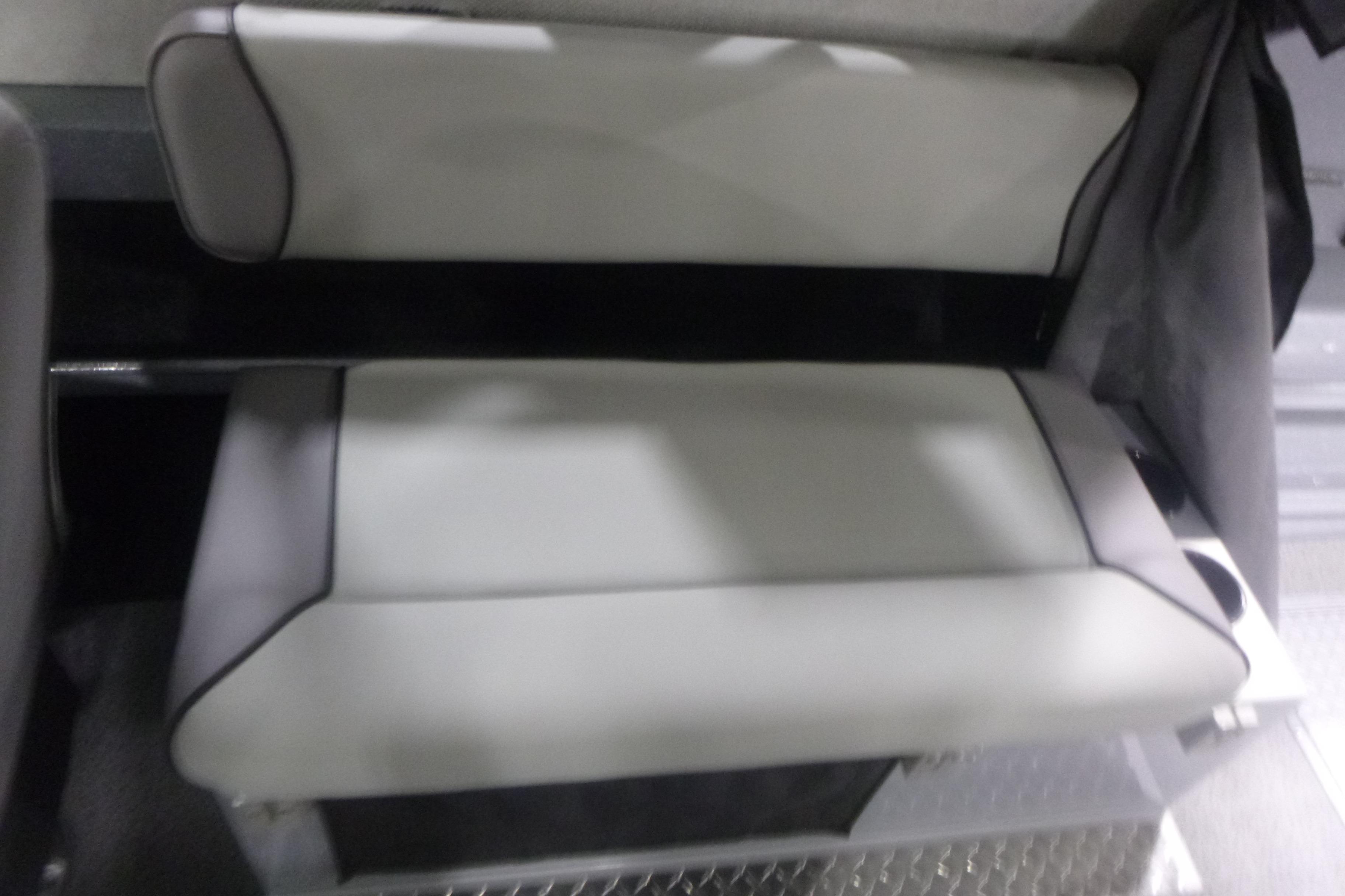 2026 KingFisher 2425 Escape HT boat seat, gray upholstery, modern design.