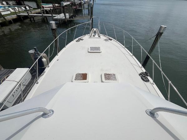 1985 Hatteras 45 Convertible yacht deck view at marina.
