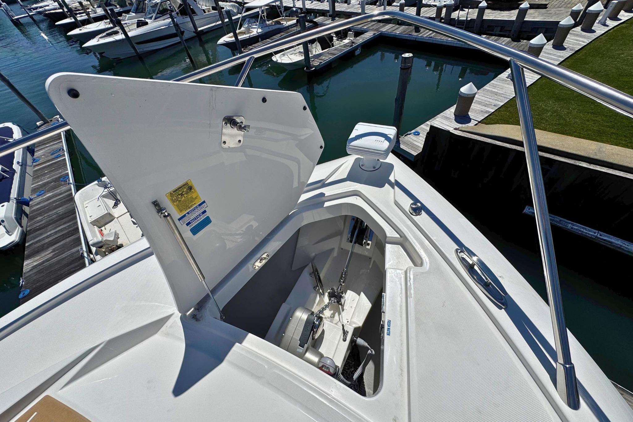 Open anchor compartment on 2027 Tiara Yachts 39 LE, docked at marina.