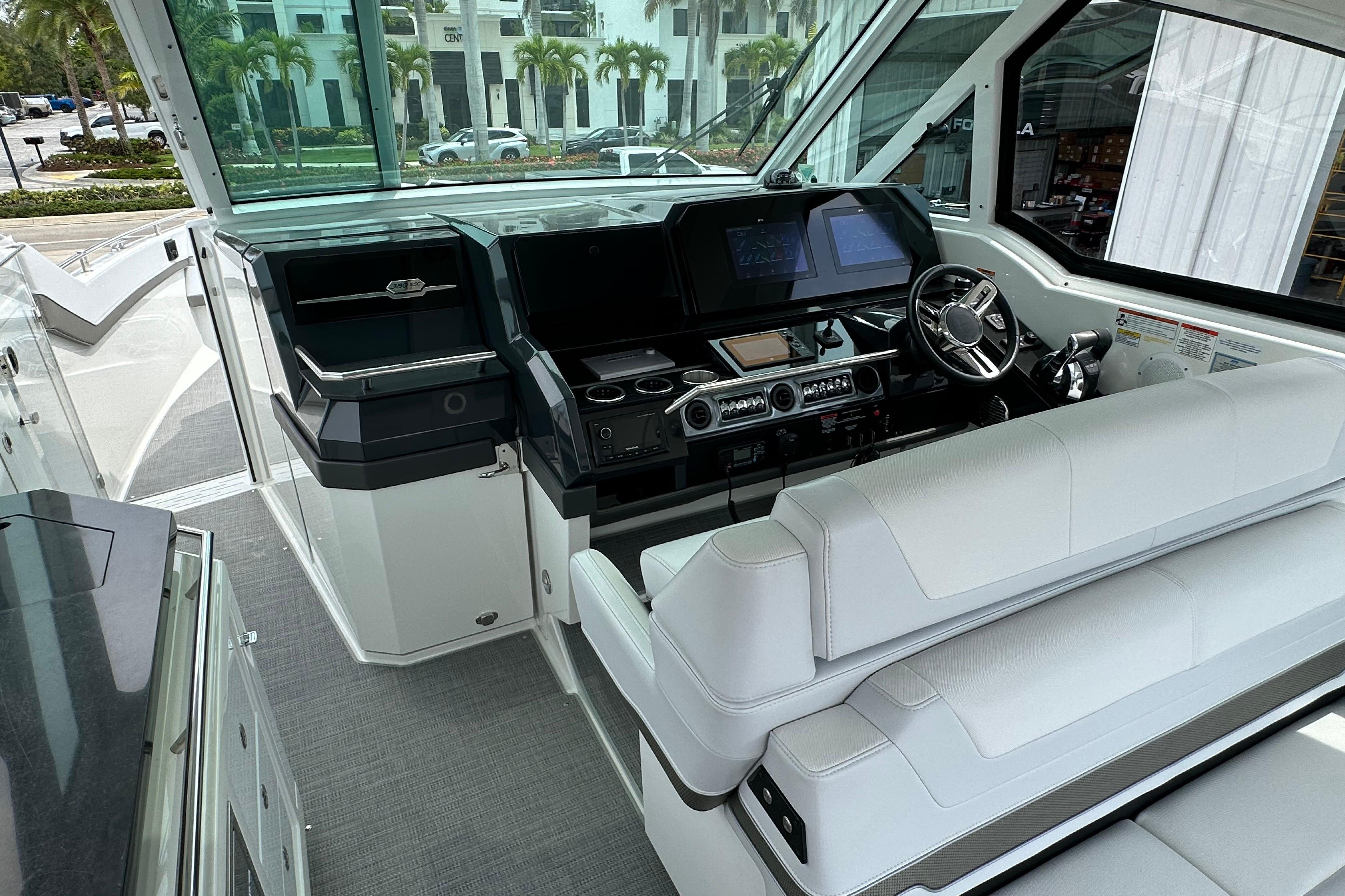 2021 Formula 380 Super Sport Crossover OB cockpit with modern controls and white seating.