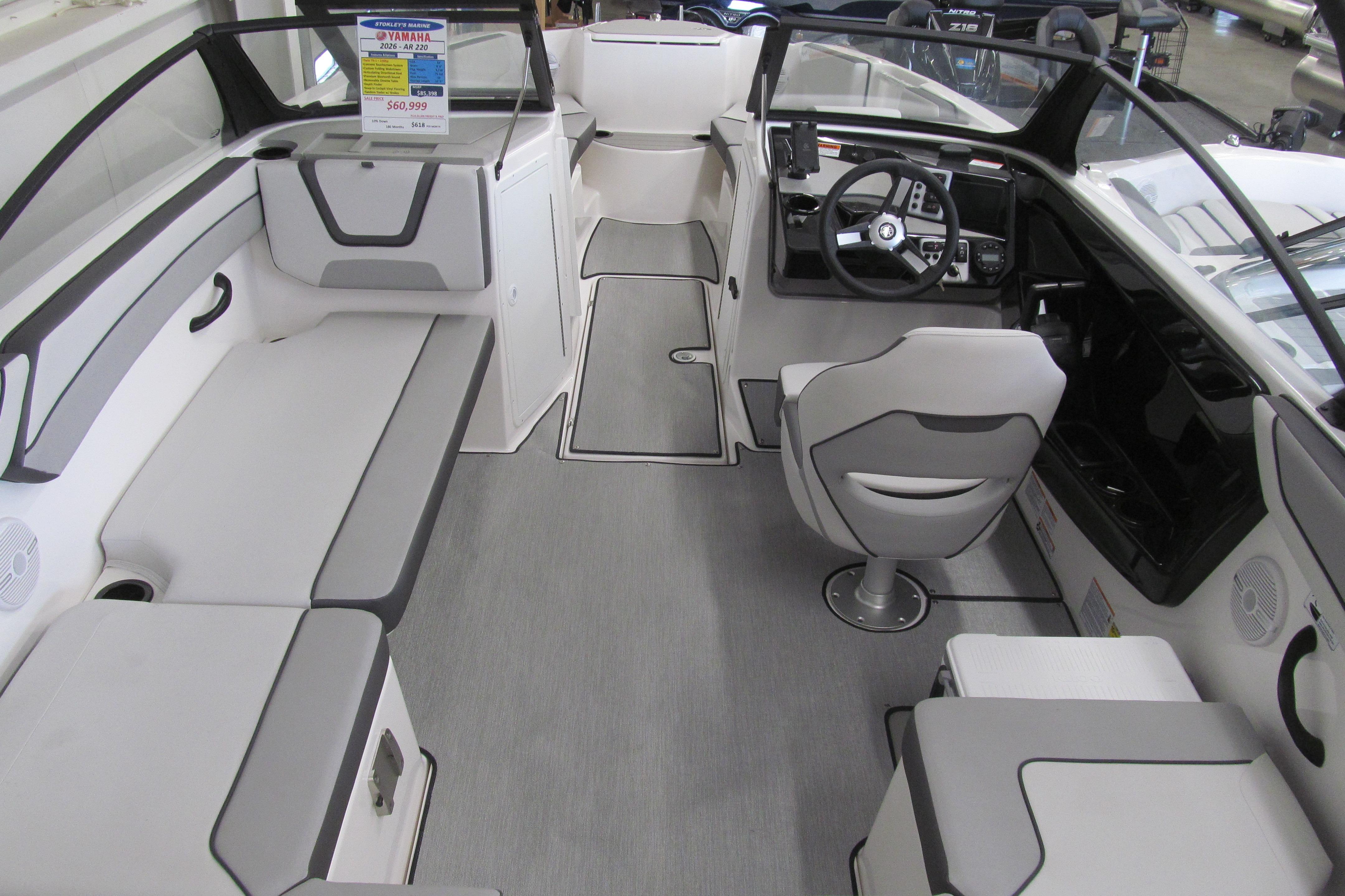 2026 Yamaha Boats AR220 interior with modern seating and sleek dashboard design.