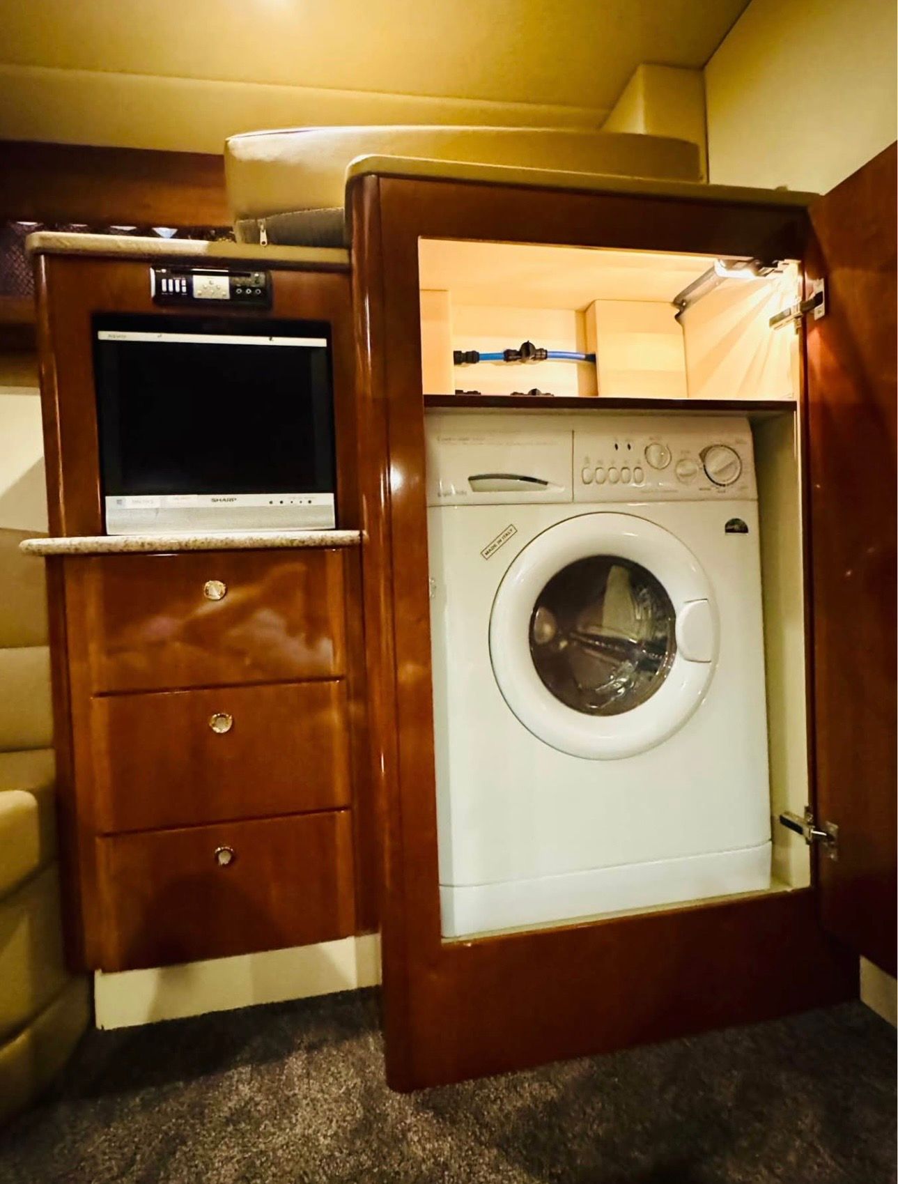 Interior of a 2007 Meridian 411 Sedan with washing machine and TV.