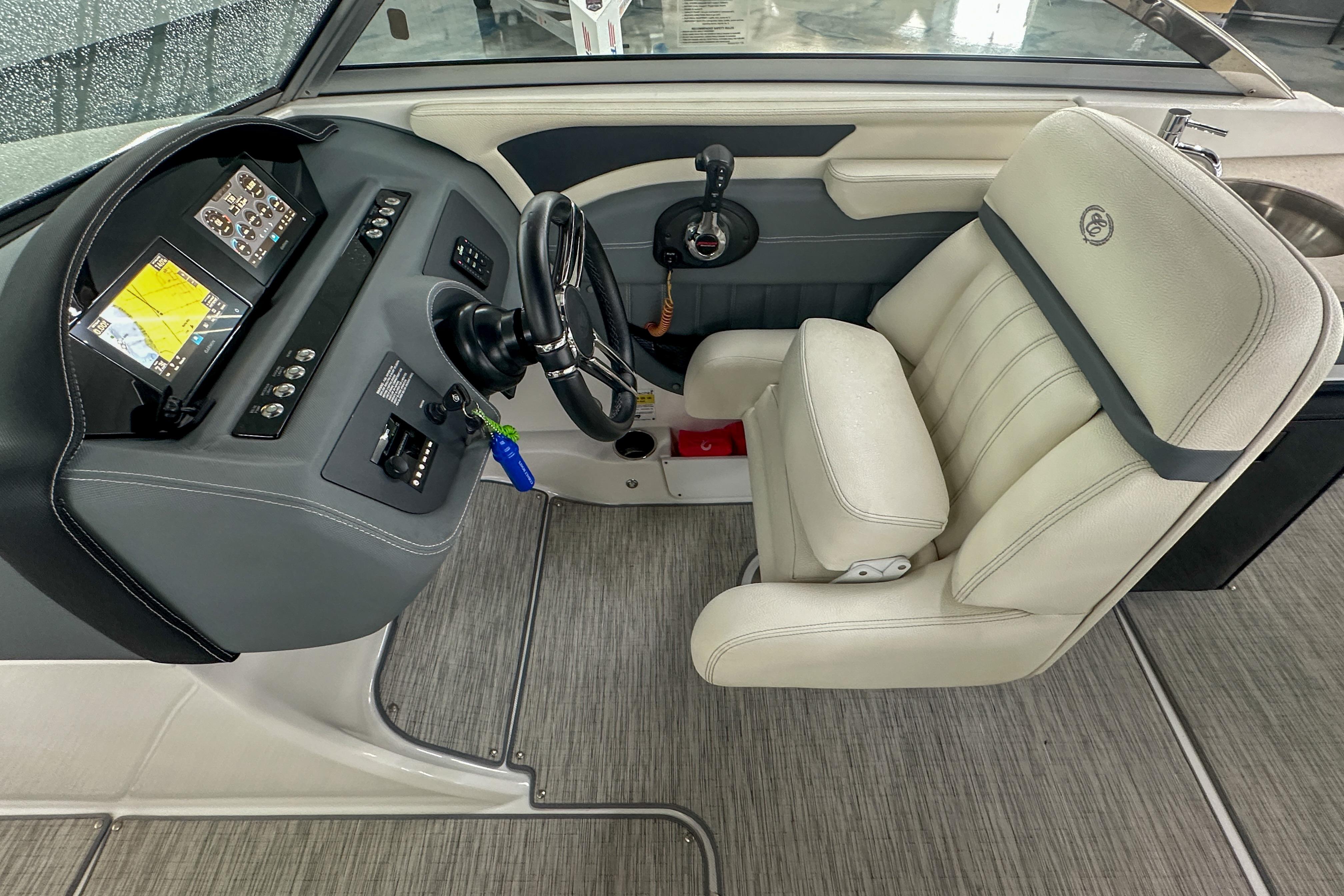2022 Cobalt 25SC boat interior with steering wheel, dashboard, and captain's seat.