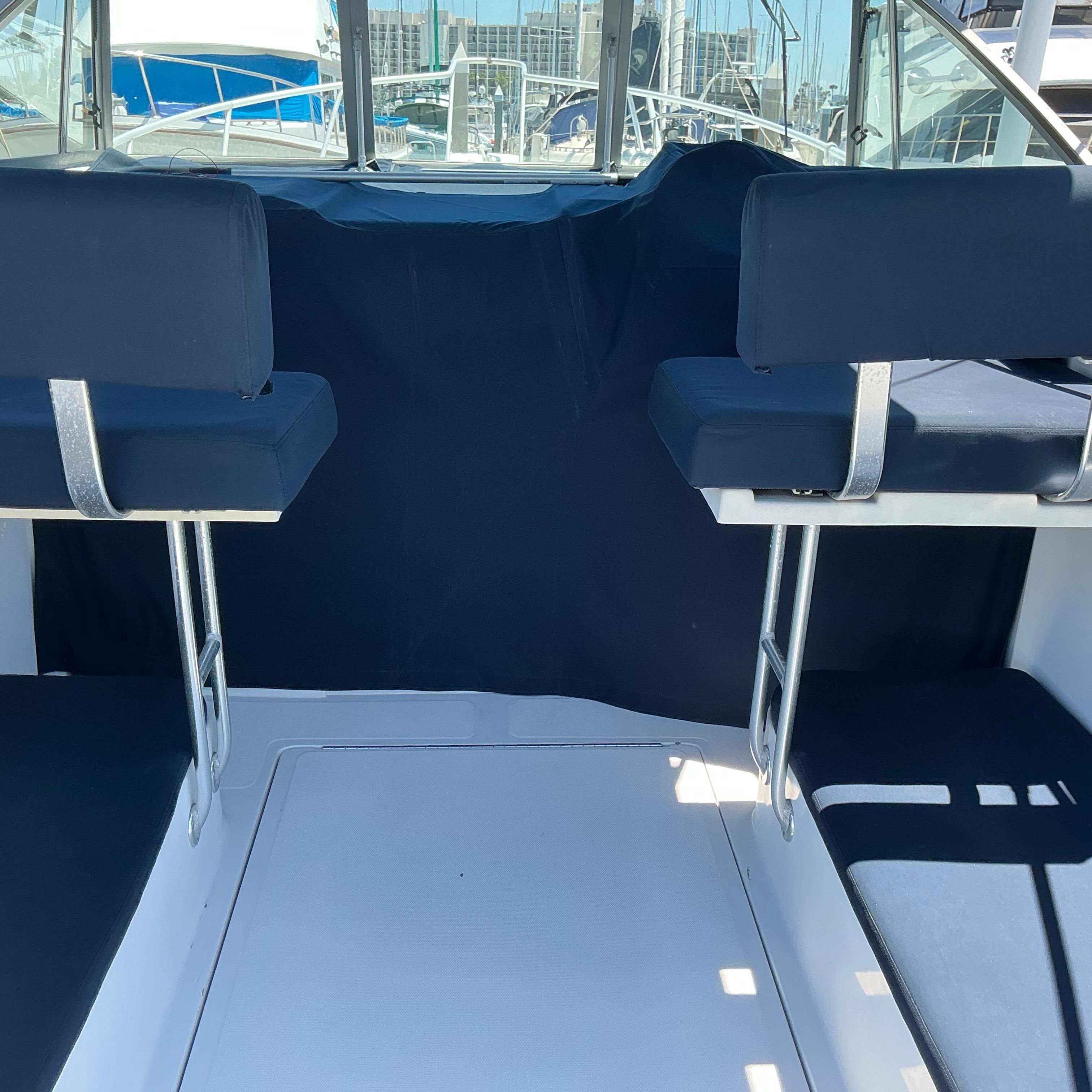 Interior of a 1999 Mainship Pilot 30 boat with blue seating.