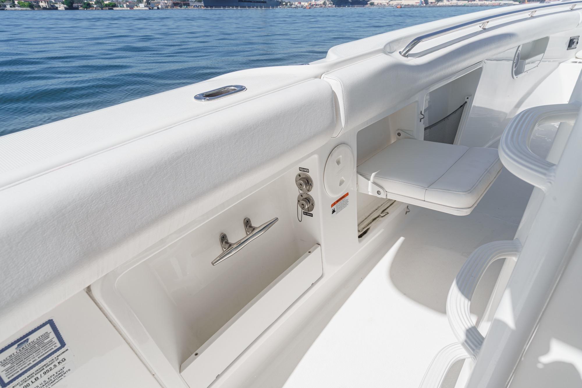 2015 Boston Whaler 370 Outrage interior with seating and storage features.