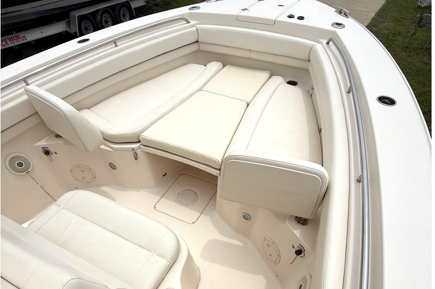 2018 Grady-White Canyon 306 boat interior with white cushioned seating.