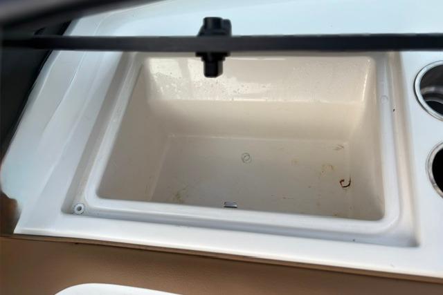 2017 Searay SPX210 boat cooler compartment with cup holders.