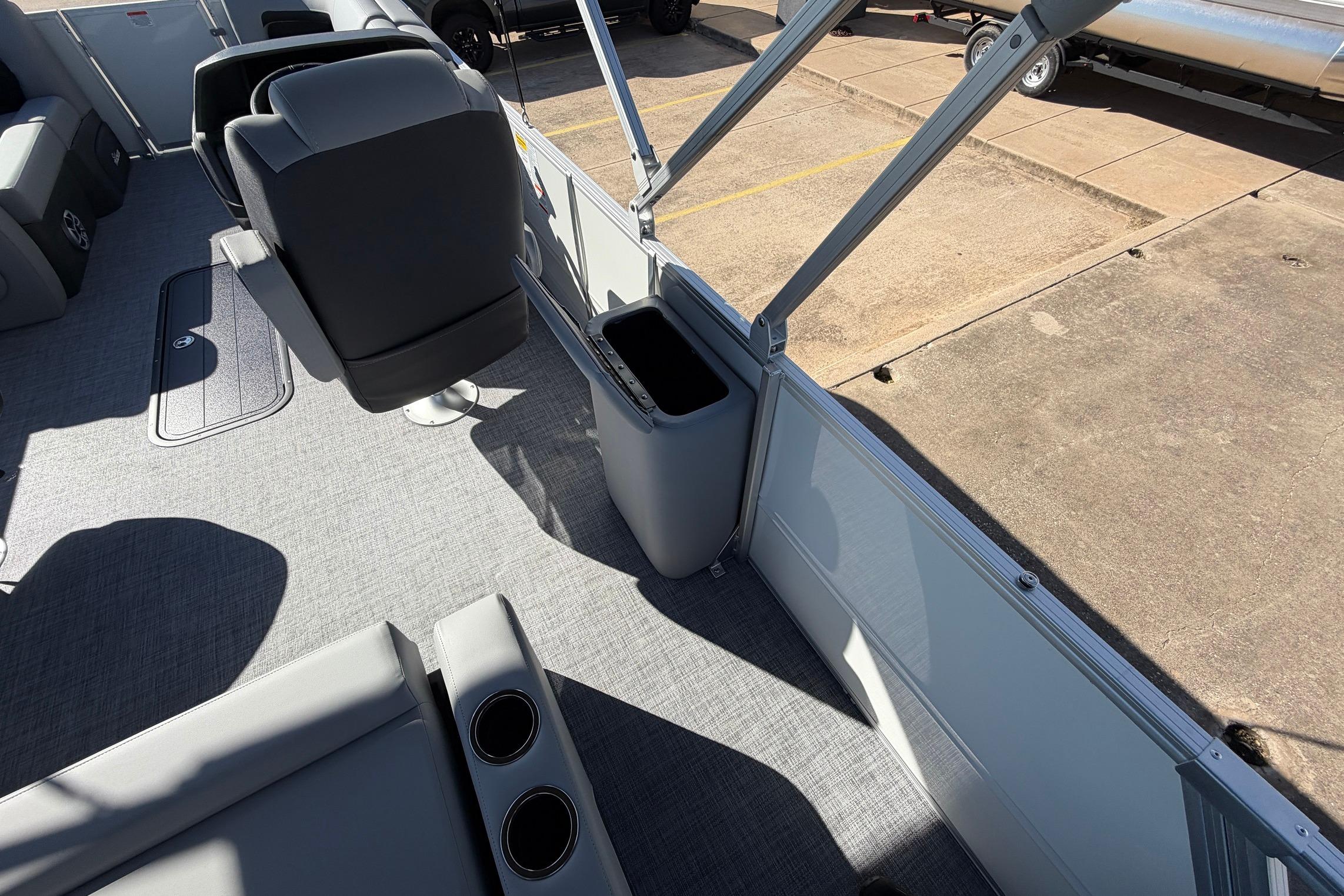 Interior of 2026 Sun Tracker Party Barge 22 RF XP3, featuring seating and cup holders.