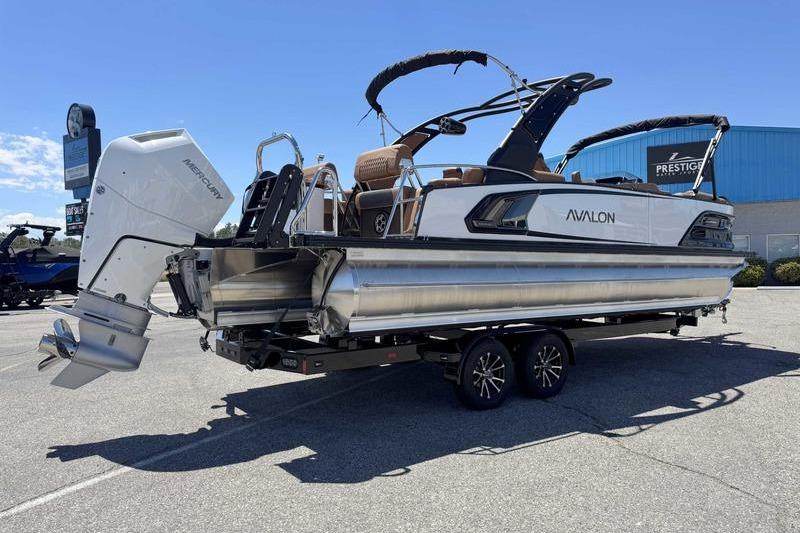 2026 Avalon Excalibur LTD Quad Lounge 27' pontoon boat on trailer, featuring sleek design.