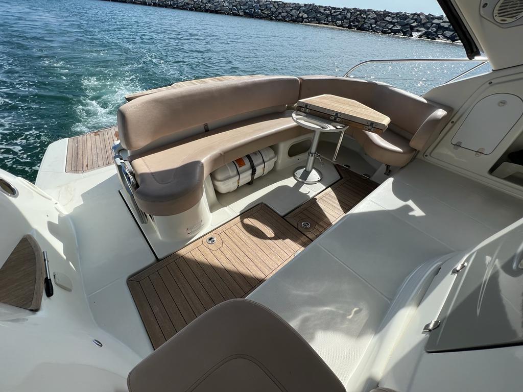 2009 Cranchi Zaffiro 36 yacht with elegant seating area on water.