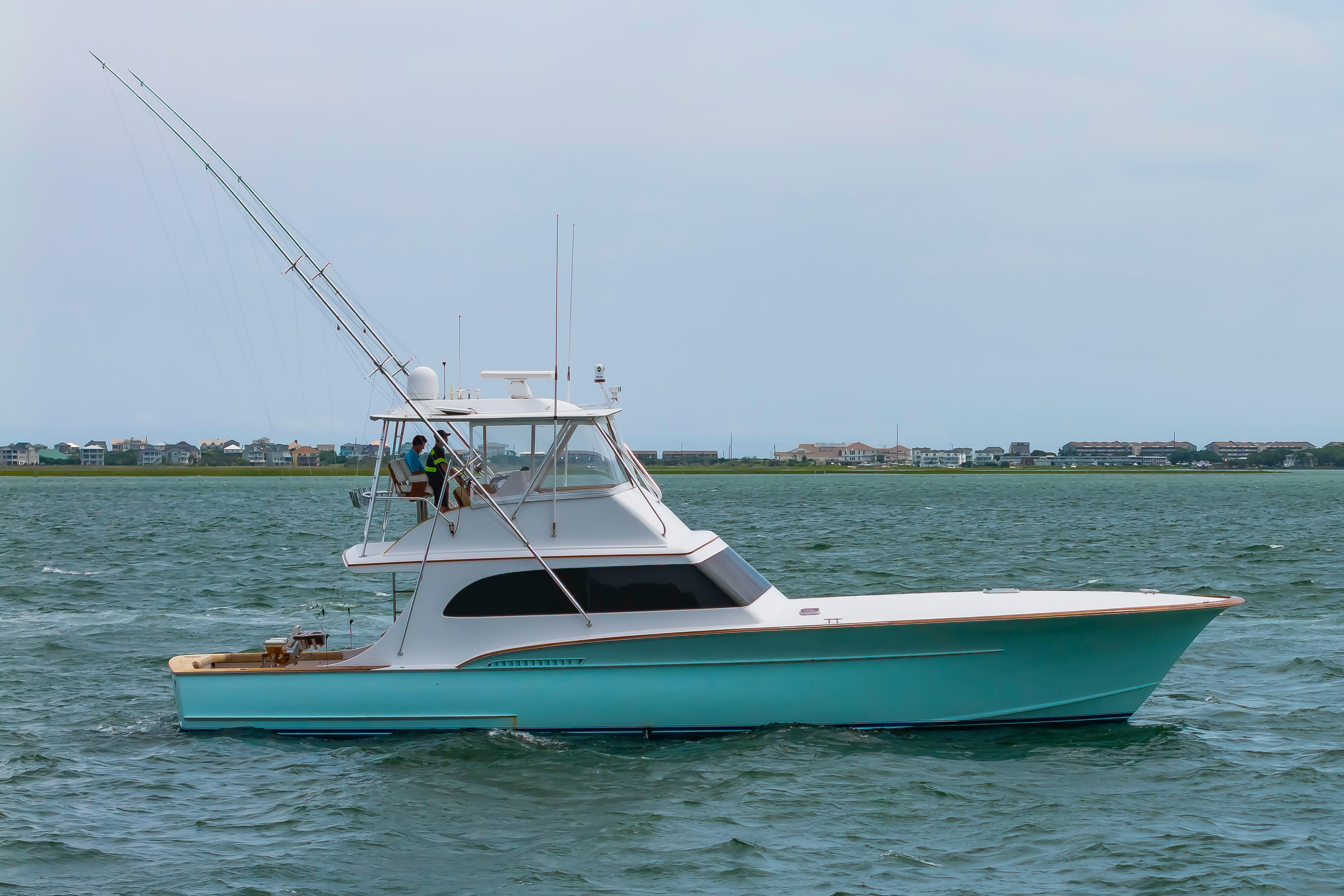 Custom Carolina Scarborough 56 Convertible yacht, 1993 model, cruising on open water.