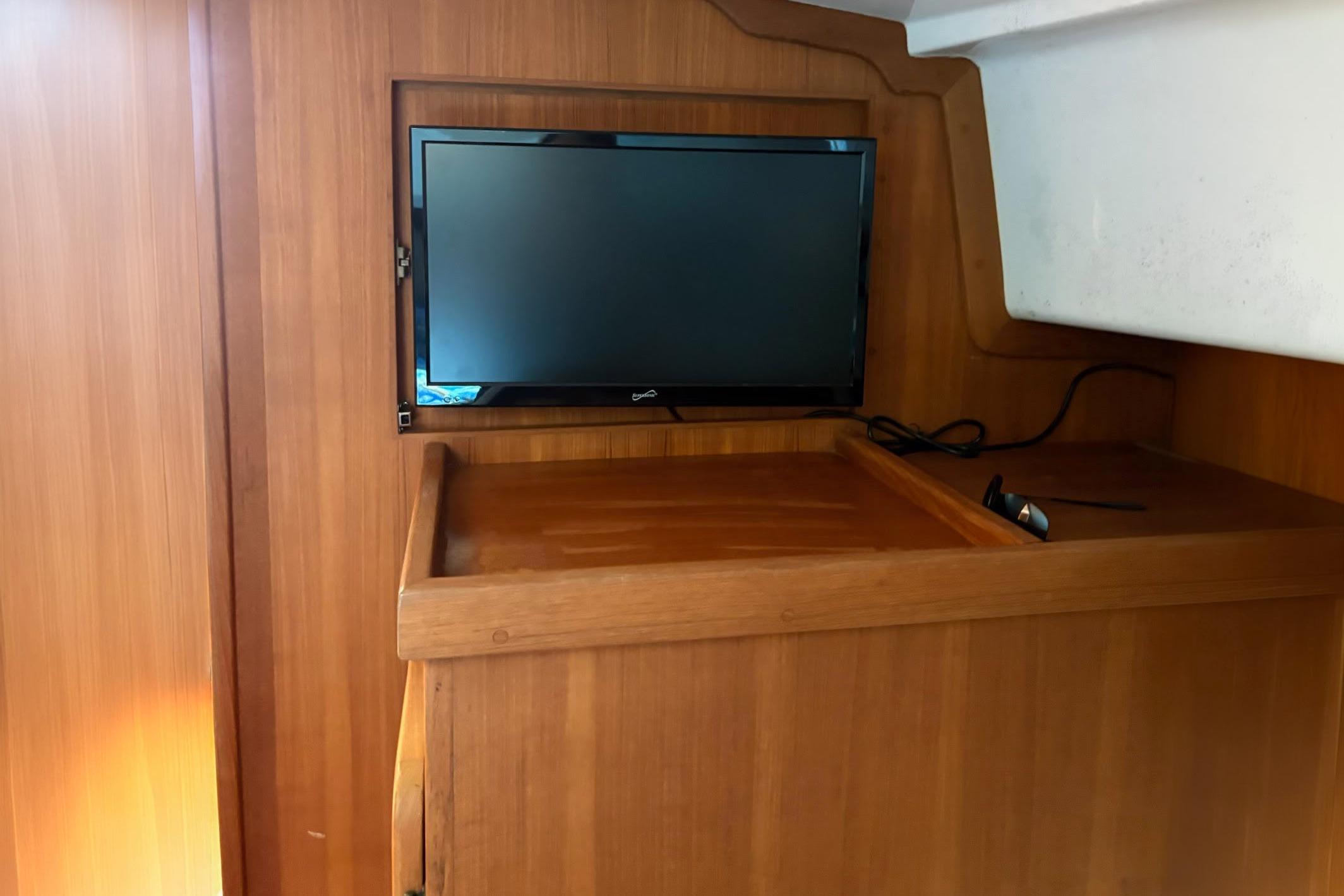 2008 Stamas 370 Express interior with mounted TV on wooden paneling.