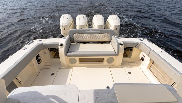 2025 Scout 425 LXF boat with quad engines on open water.