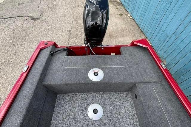 2025 Tracker Super Guide V-16 SC boat interior with motor, red and gray design.