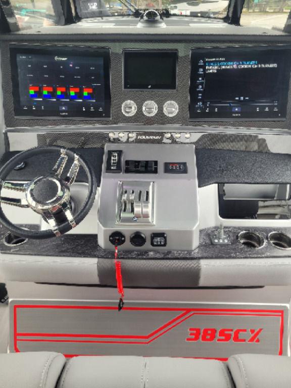2024 Fountain 38 SCX boat dashboard with advanced controls and dual displays.