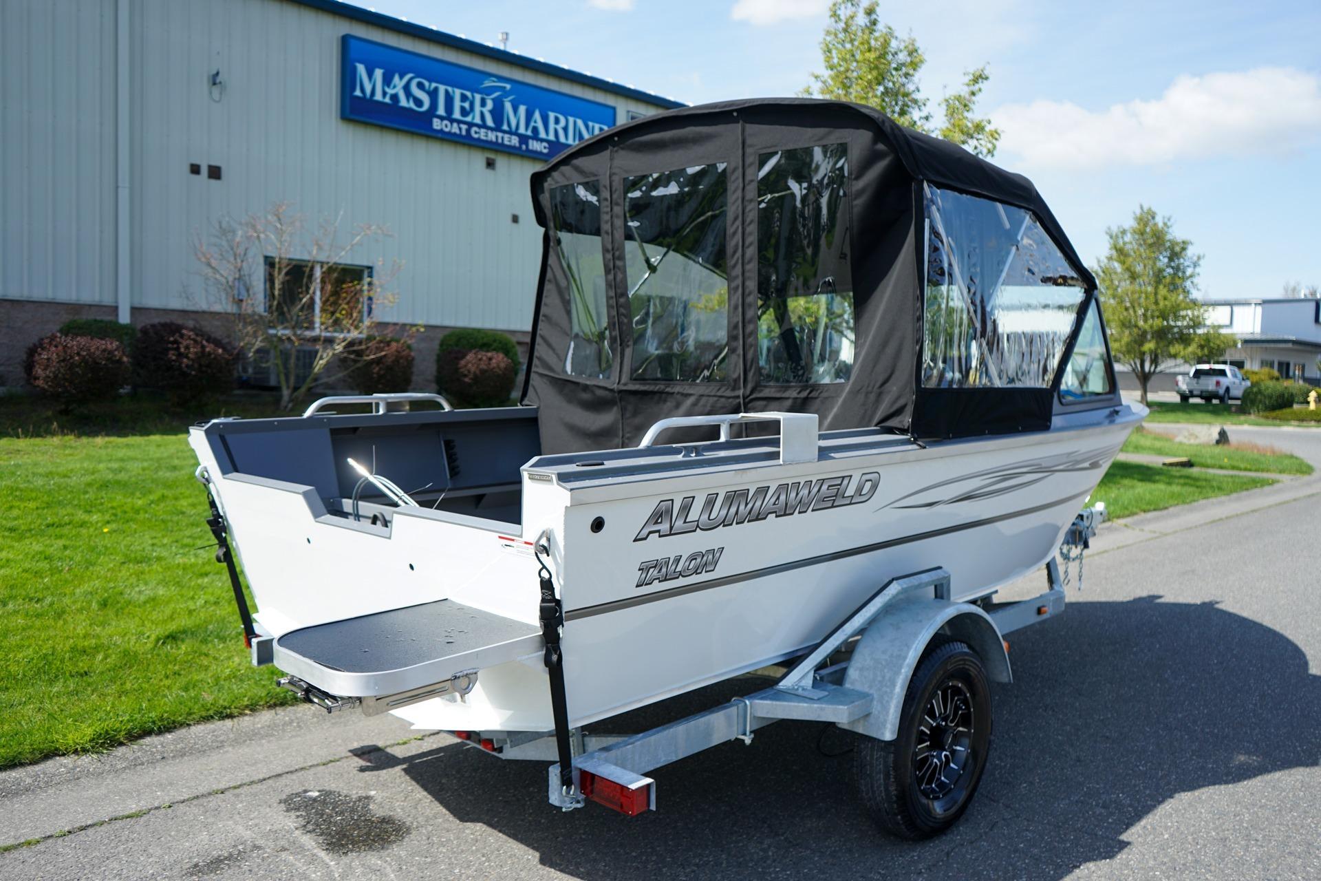 2026 Alumaweld Talon 18 boat with canopy, parked outside Master Marine Boat Center.