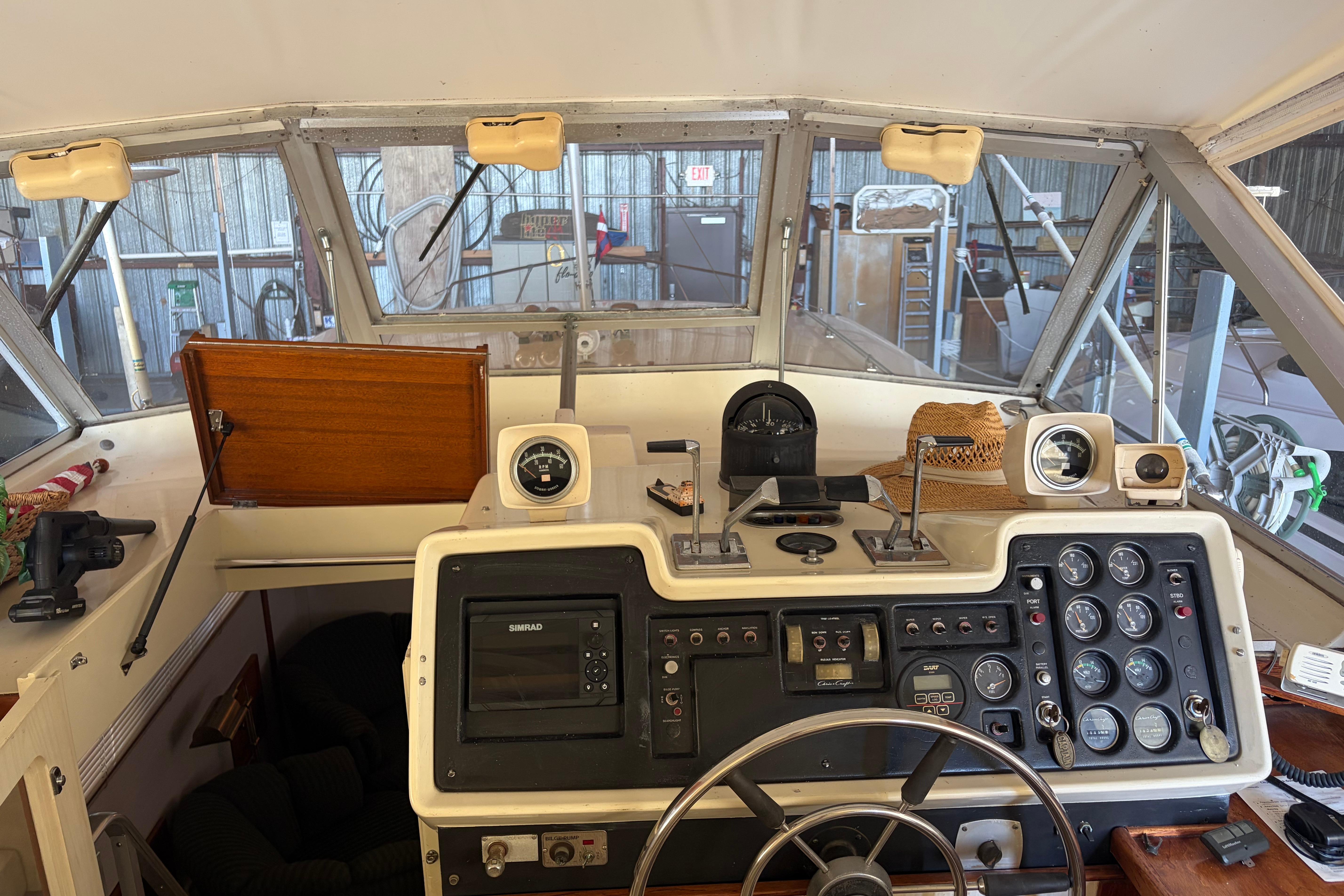 1971 Chris-Craft 42 Commander helm with gauges, controls, and navigation equipment.