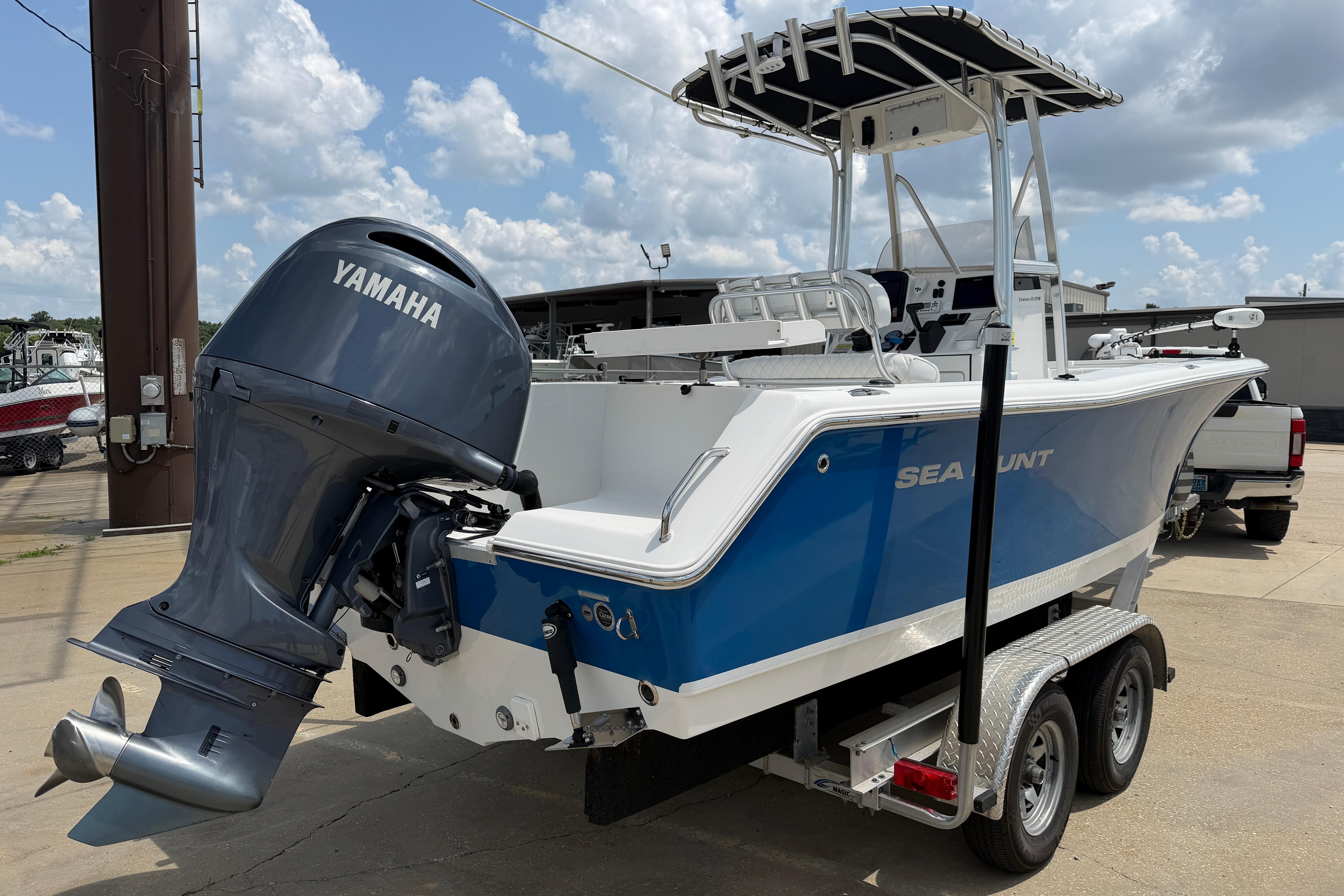 2015 Sea Hunt Triton 225 boat with Yamaha outboard motor on a trailer.