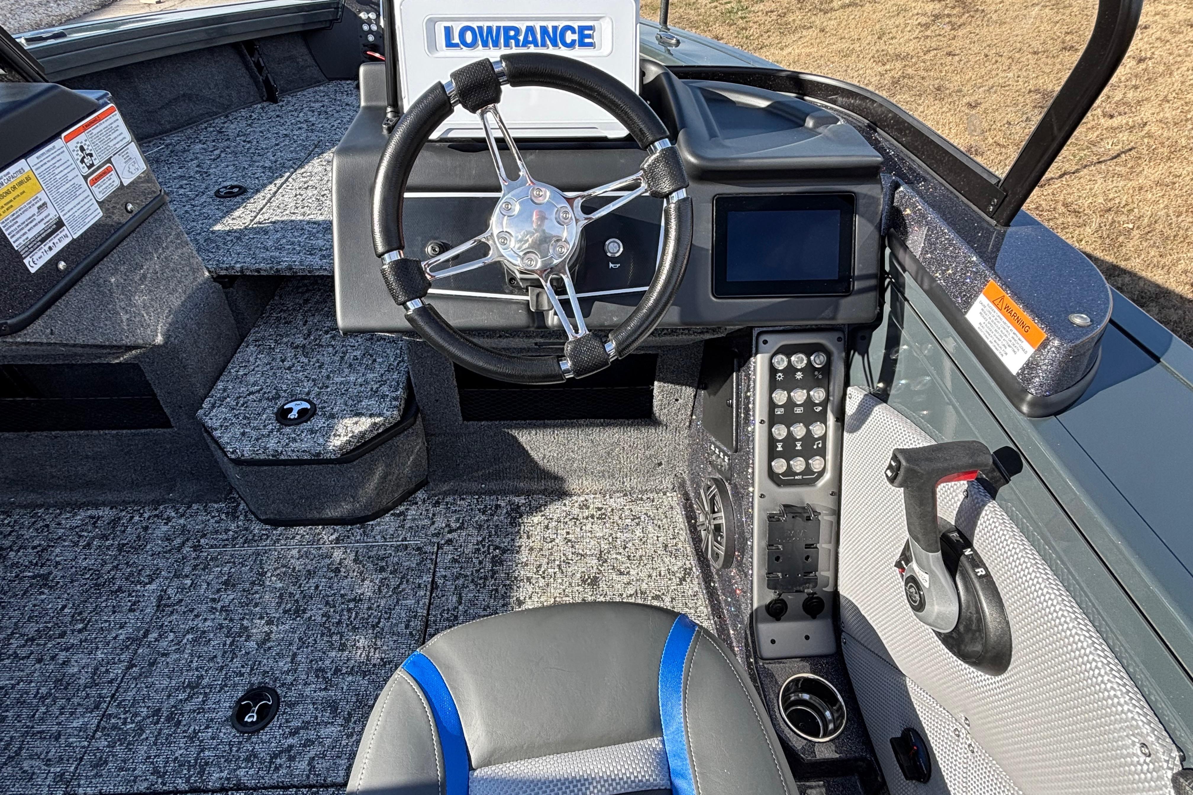 2026 Ranger VX1888 WT boat cockpit with steering wheel, Lowrance system, and control panel.