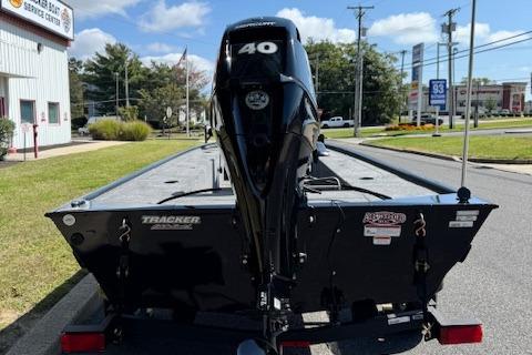 2026 Tracker Panfish 17 boat with 40 HP motor on a sunny street.