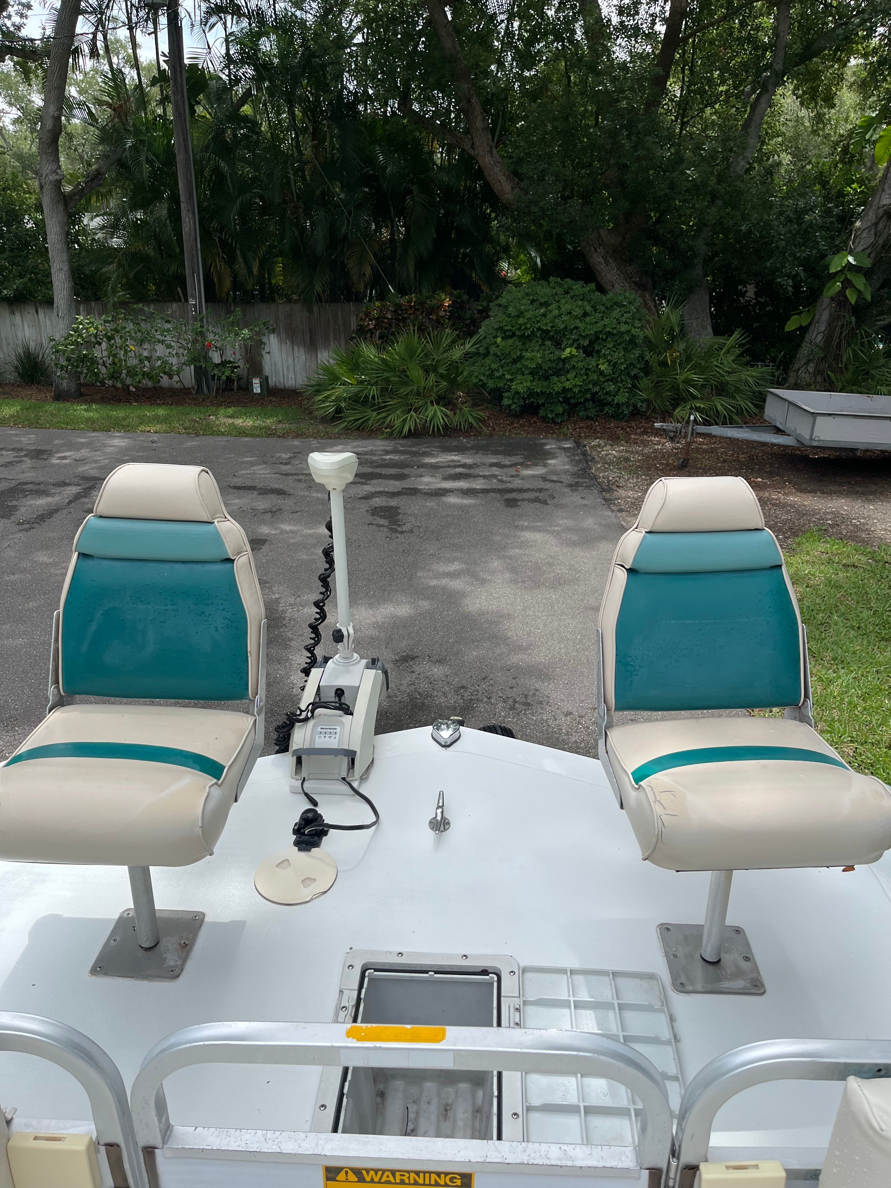1993 Hurricane Fun Deck boat with two outdoor seats.