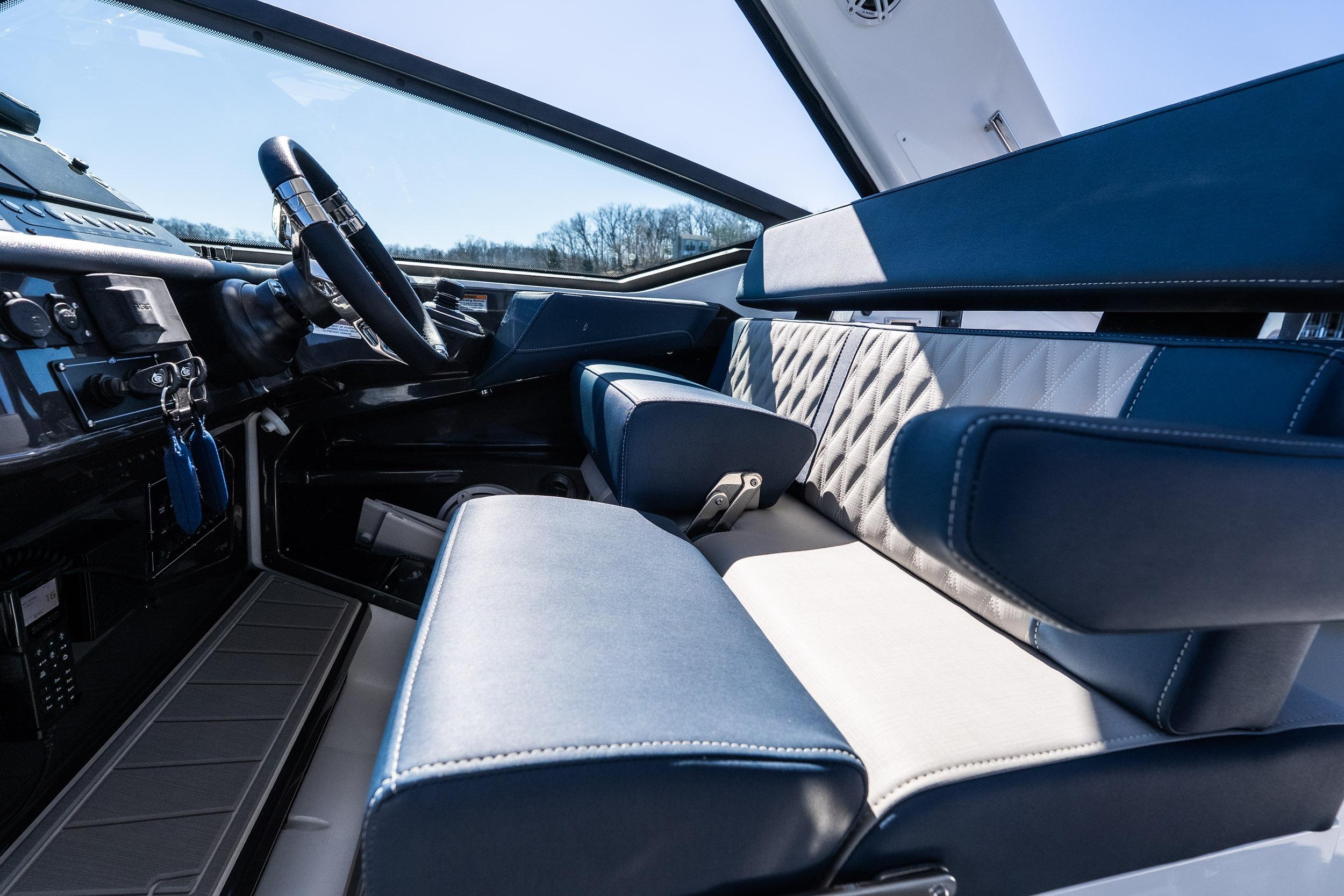 Interior of 2026 Monterey 378SS Super Sport boat with luxurious seating and steering wheel.