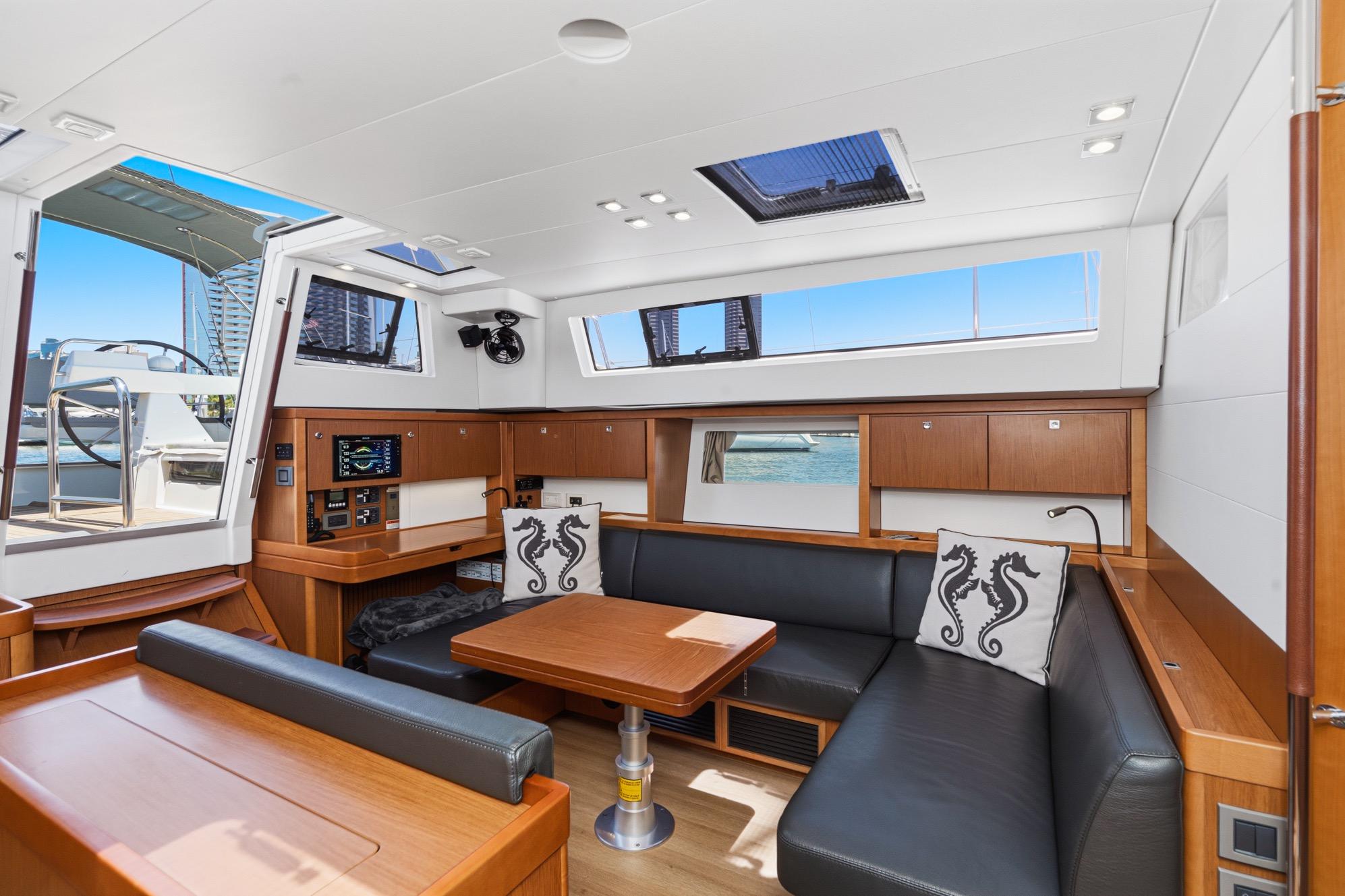 Luxurious interior of 2017 Beneteau Sense 50 yacht with modern seating and nautical decor.