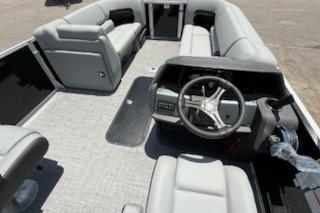 2026 Sun Tracker Party Barge 22 XP3 interior with spacious seating and modern steering console.
