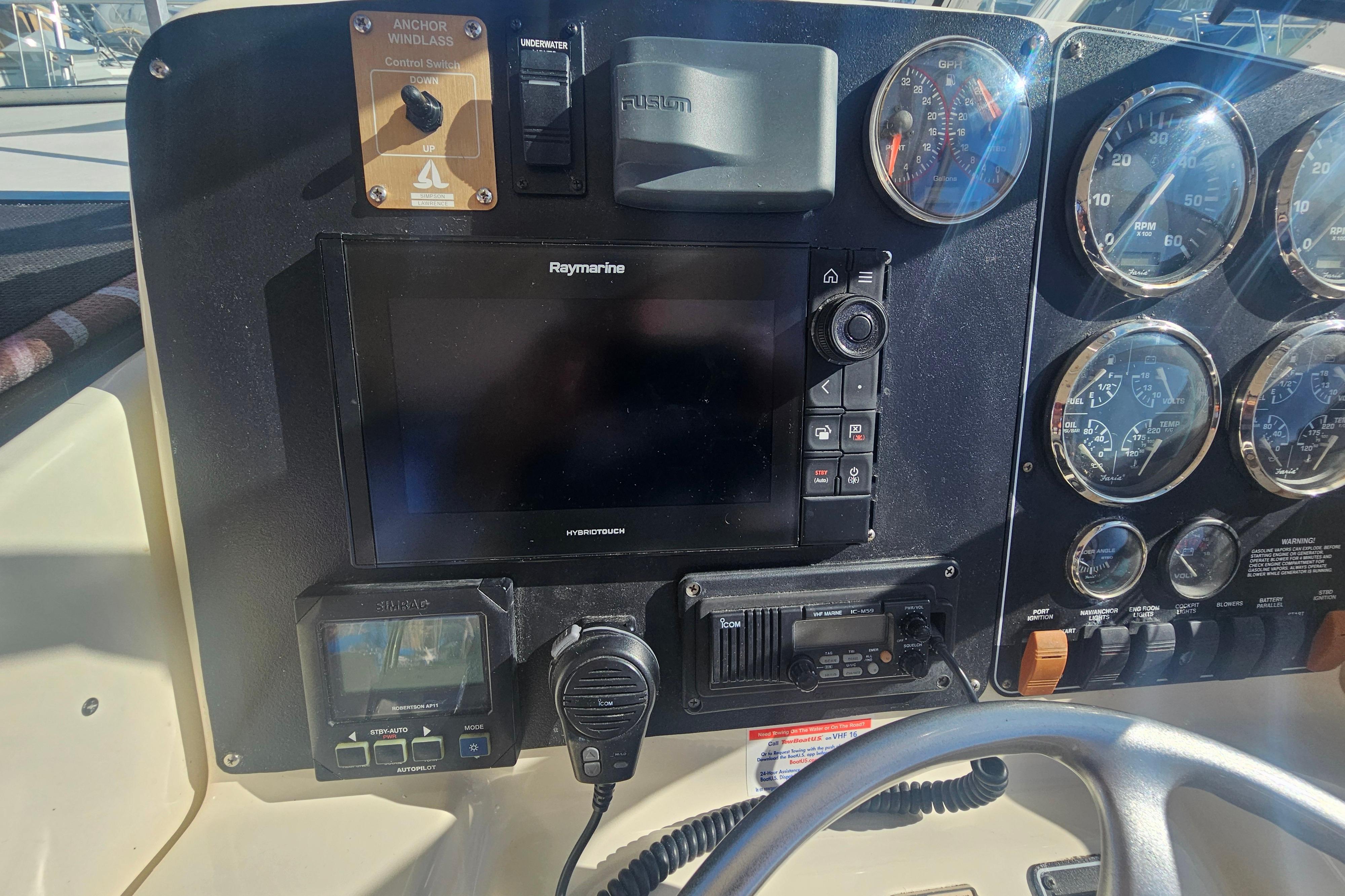 Control panel of a 2001 Pursuit 3000 Express boat with navigation and communication equipment.