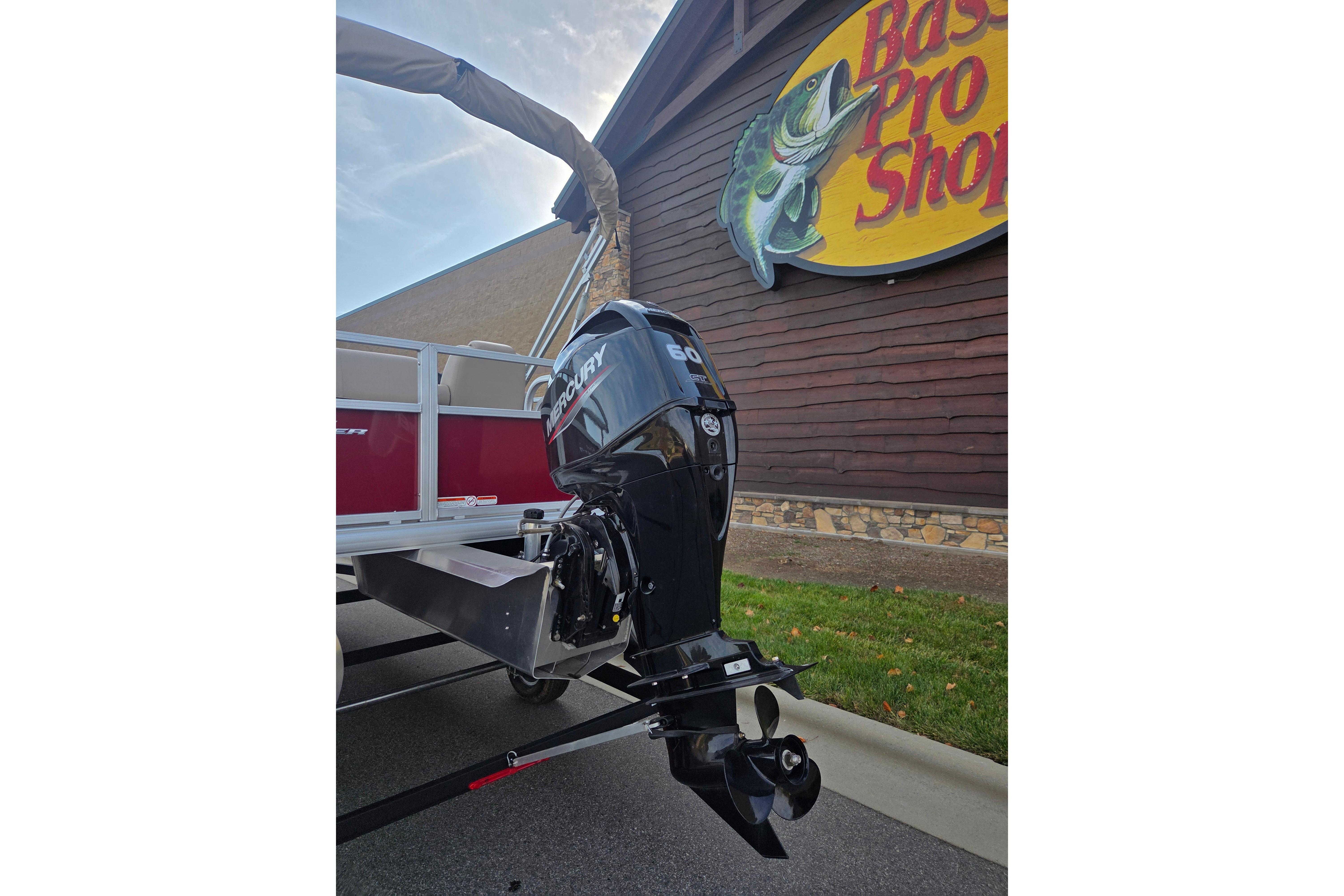 2025 Sun Tracker Party Barge 18 DLX with Mercury outboard at Bass Pro Shop.
