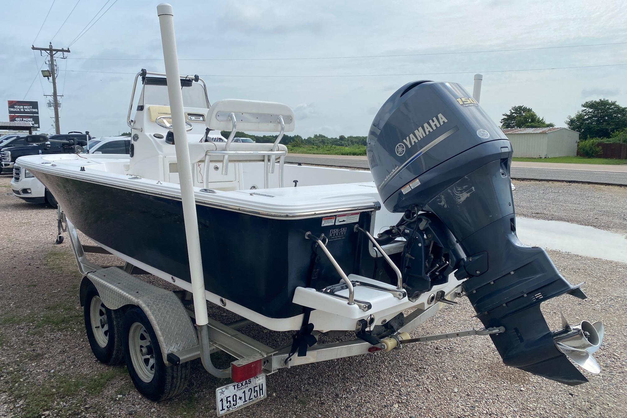 2013 Sportsman Masters 227 Bay Boat with Yamaha outboard motor on trailer.