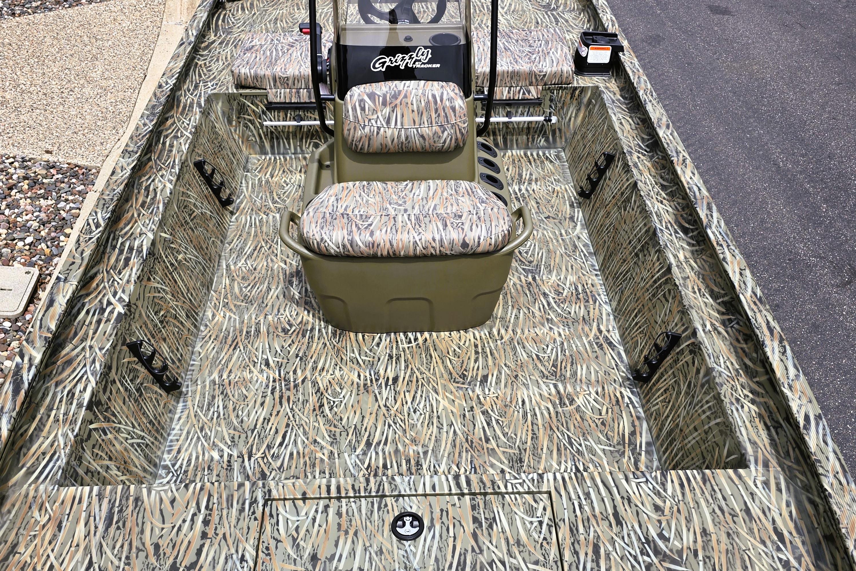 2026 Tracker Grizzly 1860 CC boat with camouflage interior design.