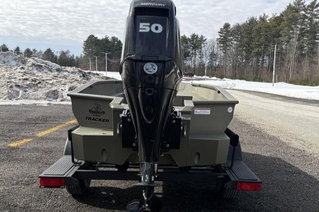 2026 Tracker Grizzly 1650 T Prairie Wings Edition boat with Mercury 50 engine on trailer.