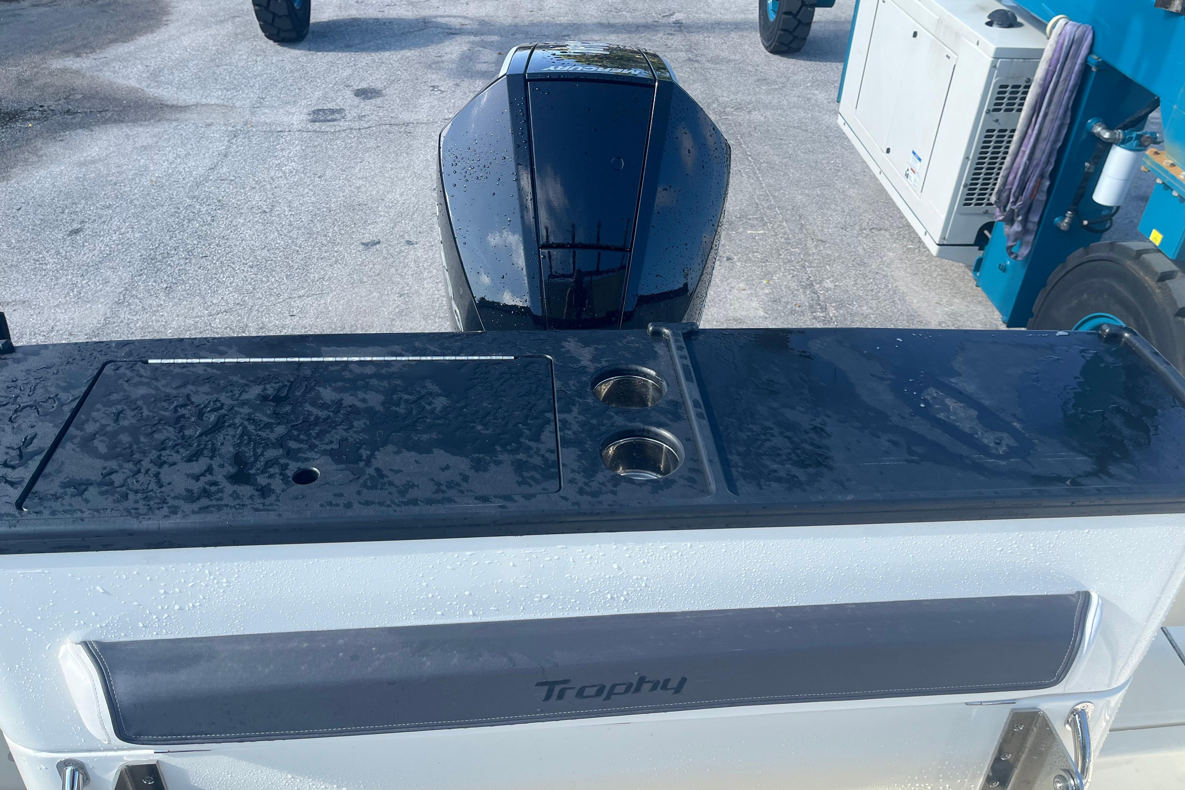 2025 Bayliner Trophy T25 Pilothouse boat with sleek design and wet surfaces.