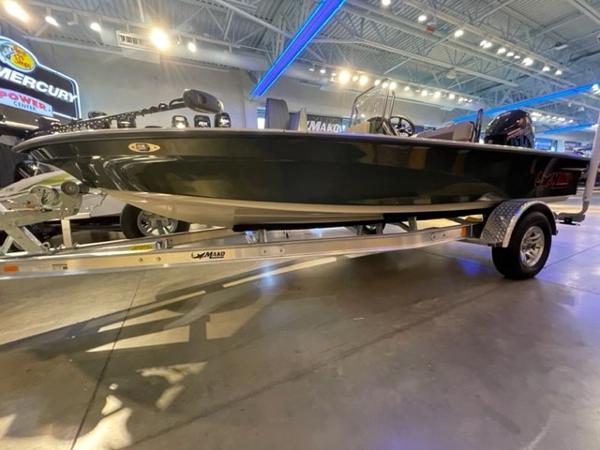 2025 Mako 18 Pro Skiff Backwater Edition on display in a showroom.