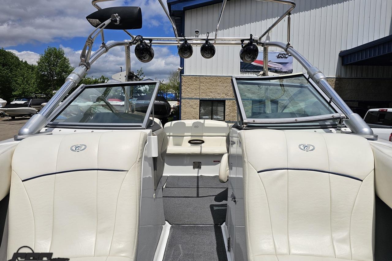 2010 Cobalt 232 WSS boat interior with white seating and wakeboard tower.