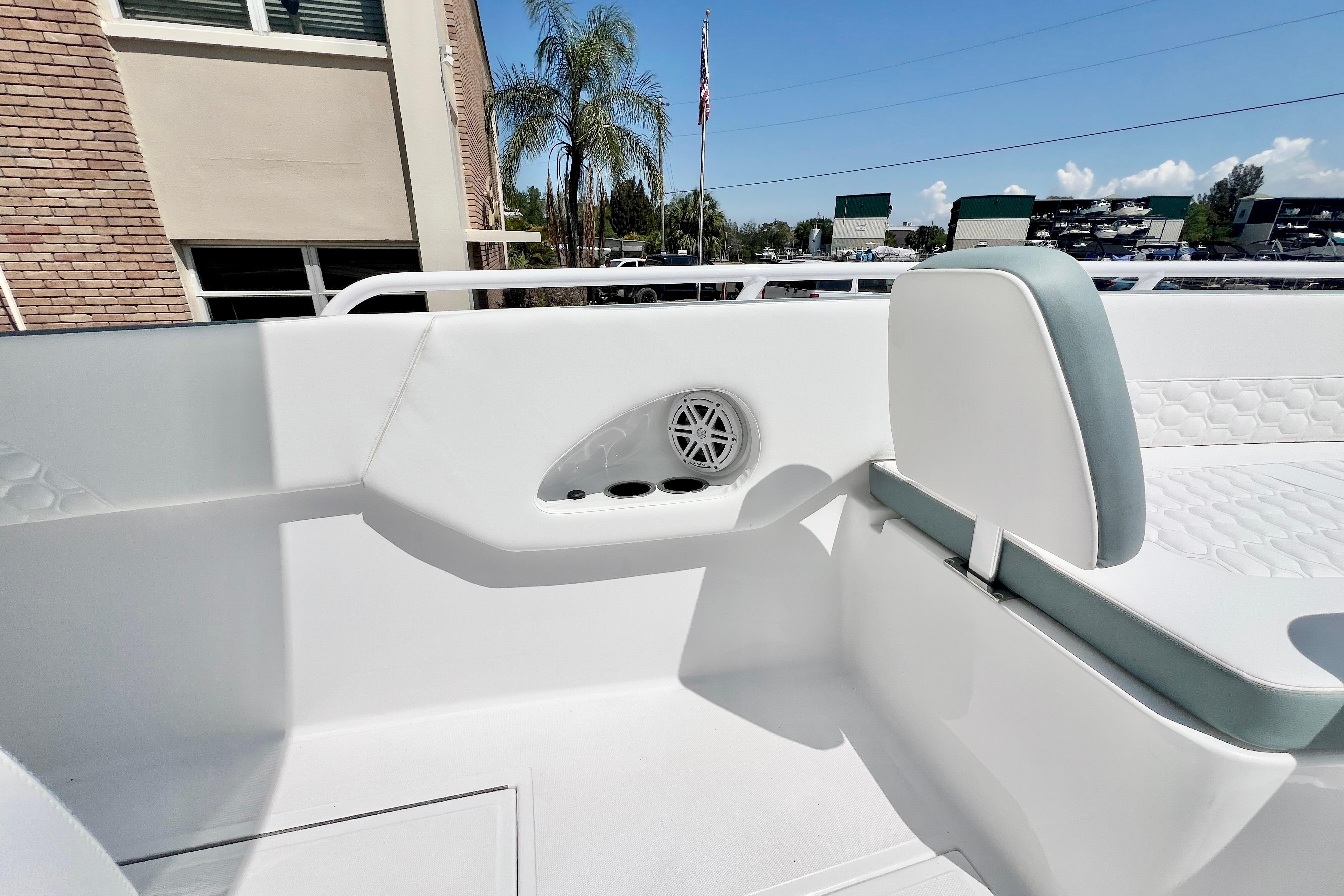 2026 Stamas 31T Aventura boat interior with white seating and speaker detail.
