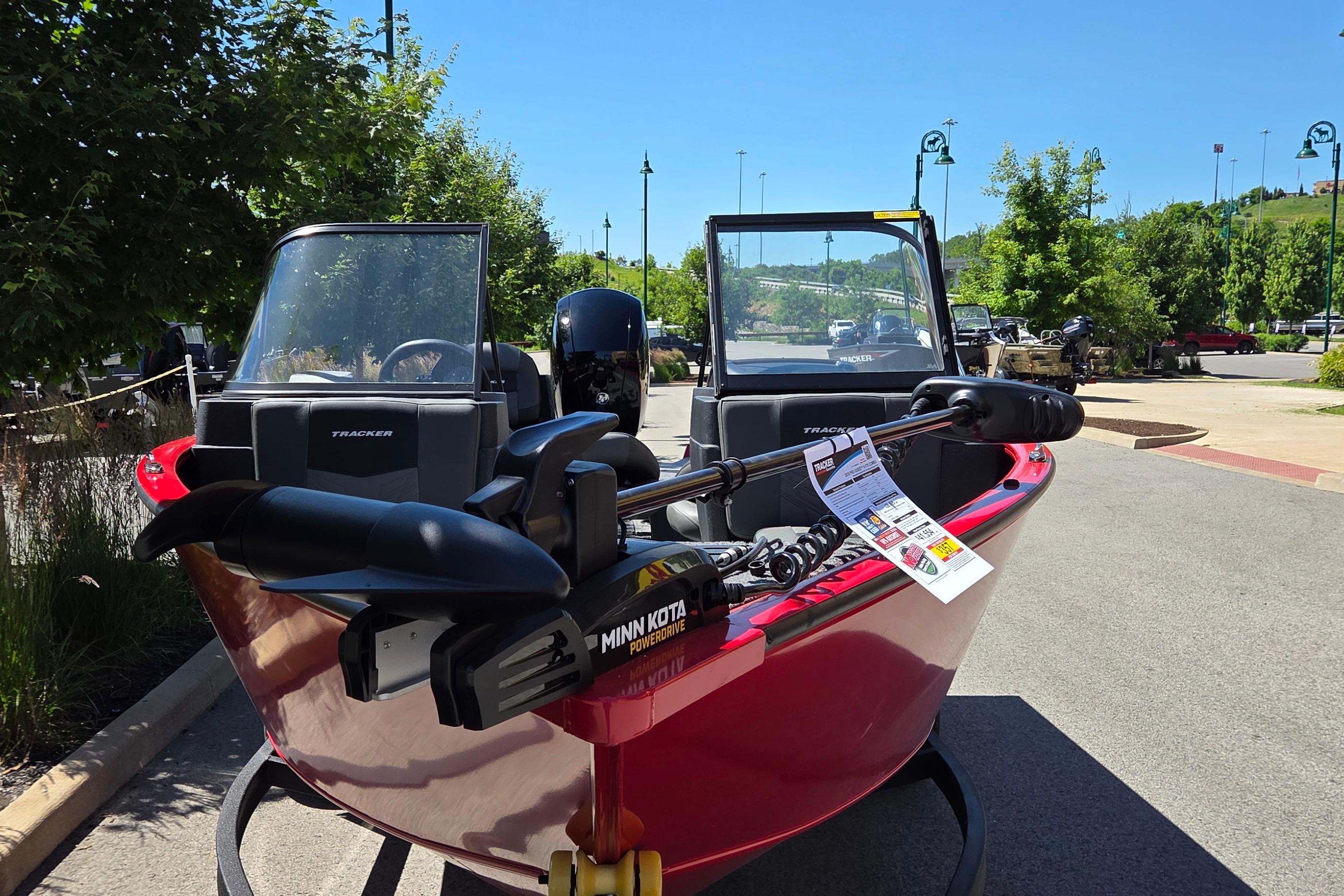 2026 Tracker Pro Guide V-175 Combo boat with Minn Kota motor, parked outdoors.