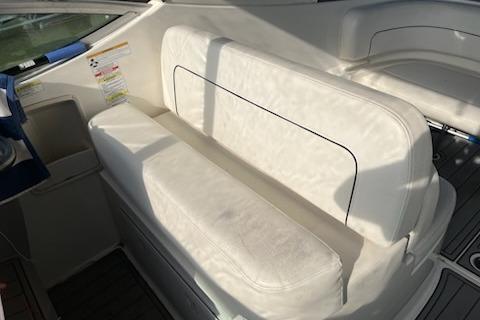 2012 Bayliner 285 Cruiser interior with white seating and sleek design.