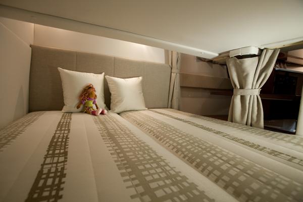 Manufacturer Provided Image: 2017 Four Winns Vista 275 cabin bed with pillows and doll.