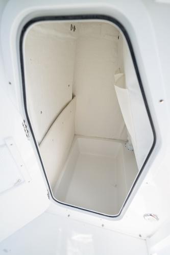 2024 Sea Hunt Ultra 234 storage compartment interior view.