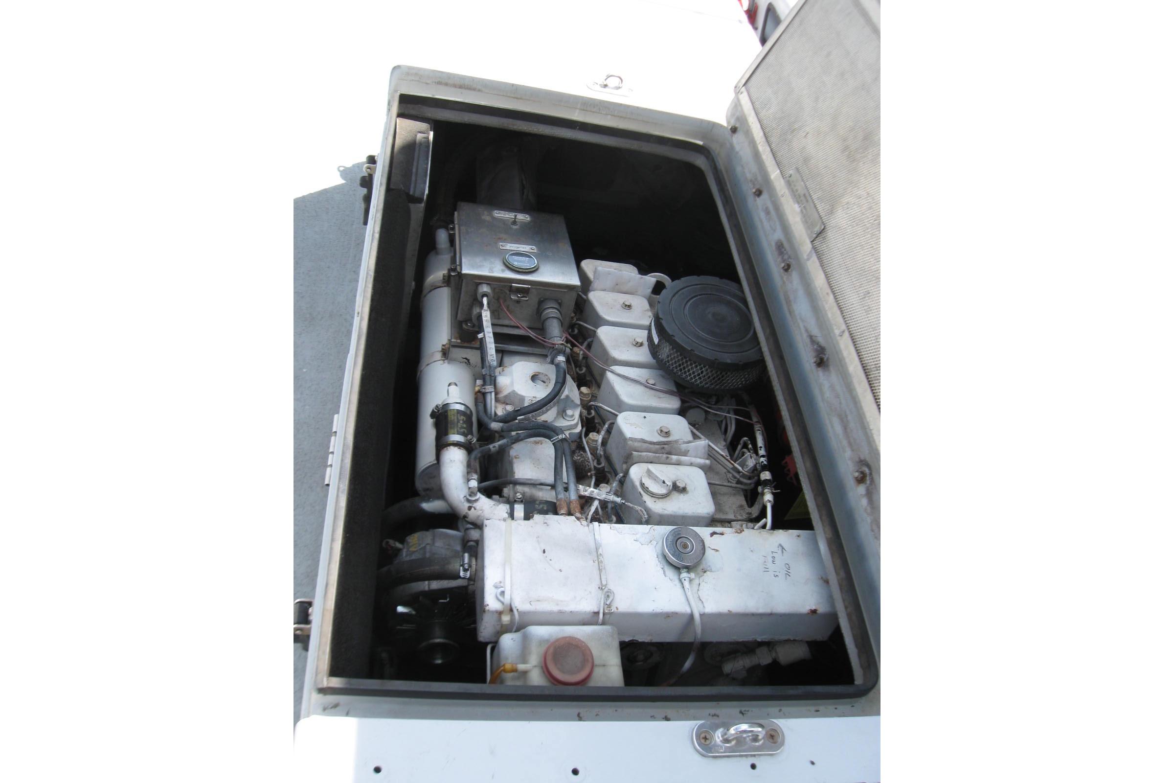 Engine compartment of a 1994 Willard US Navy vessel, showcasing mechanical components.