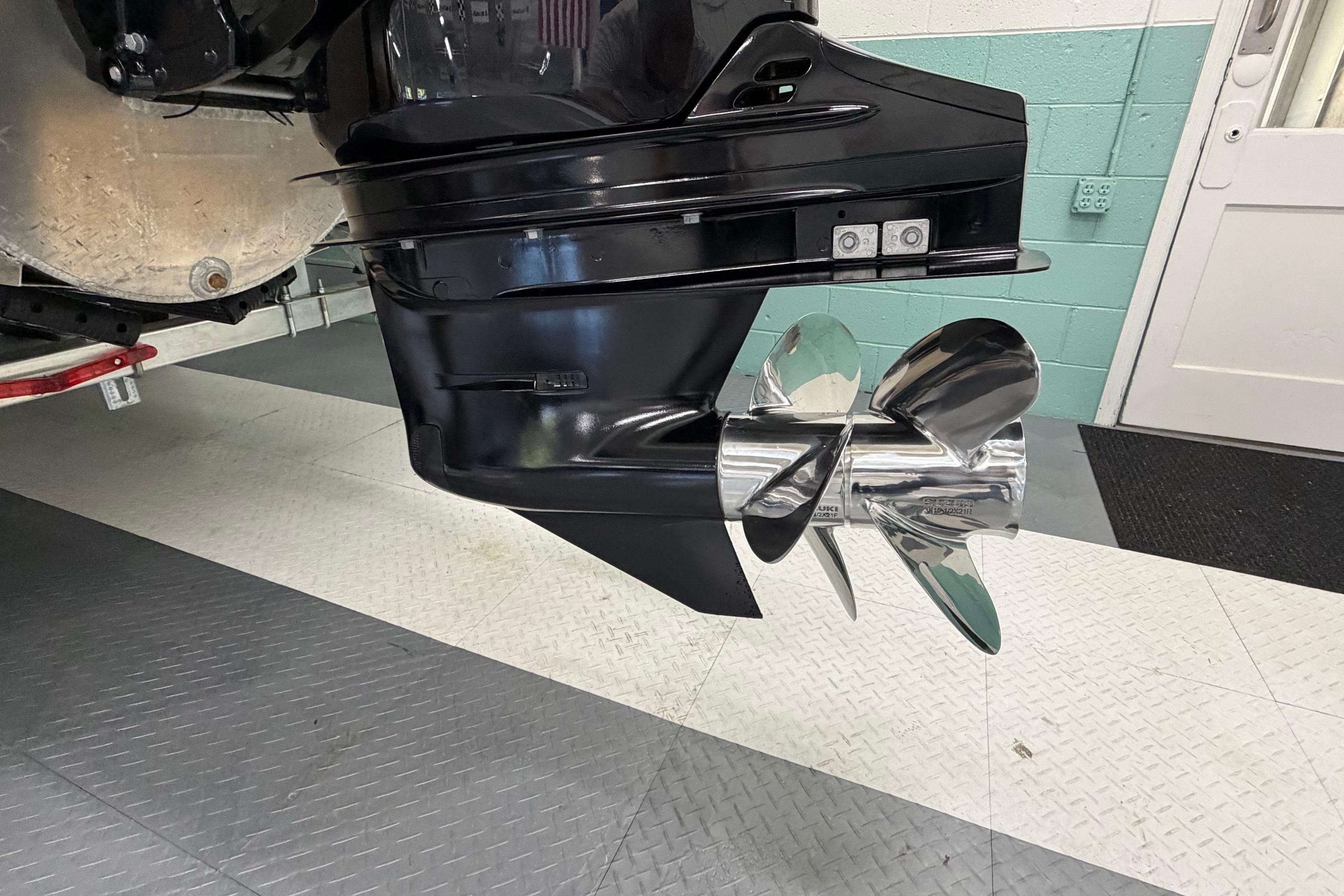 Close-up of a 2026 South Bay 525SB2 boat propeller in a garage setting.