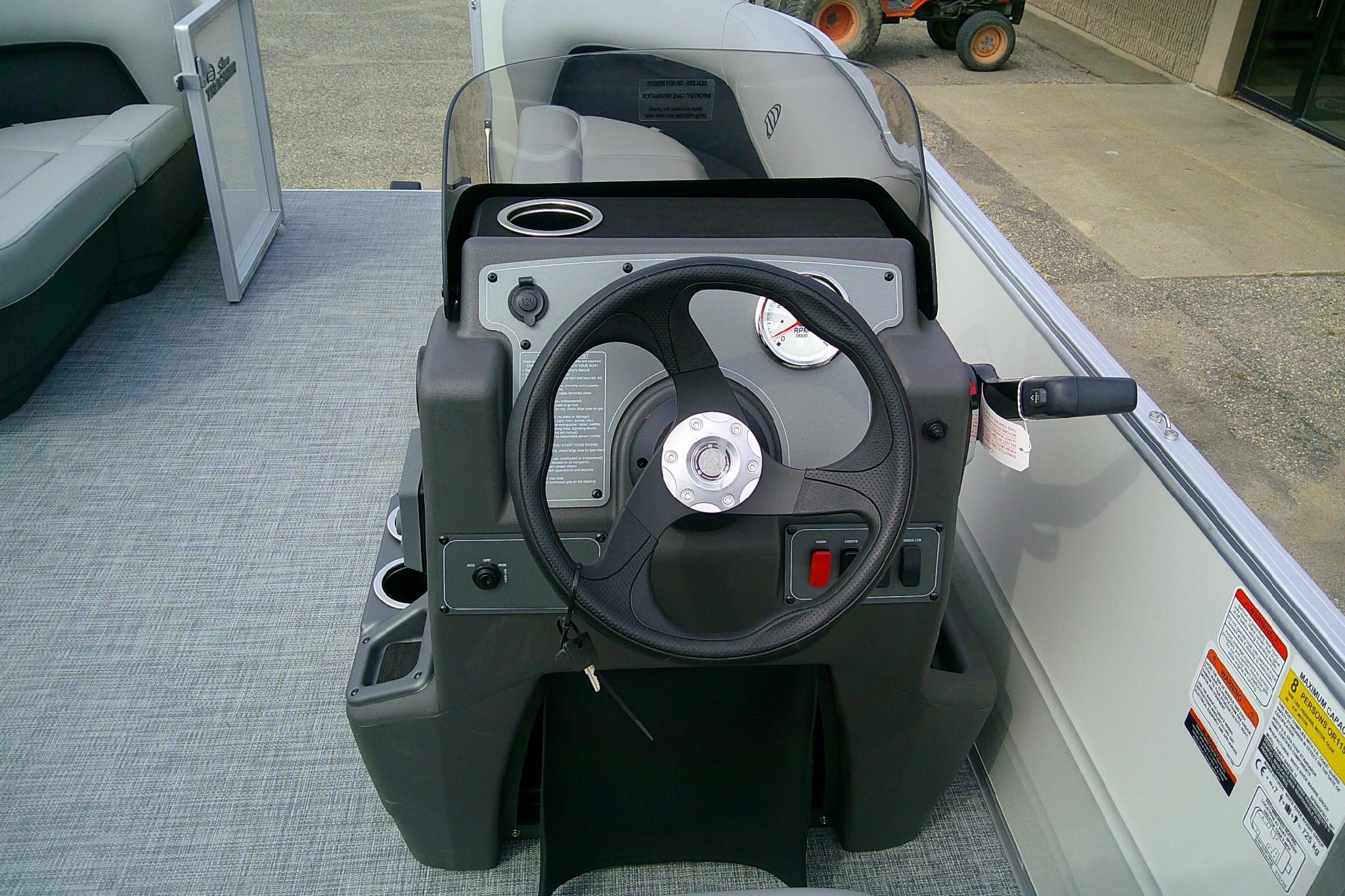 Steering console of 2026 Sun Tracker Party Barge 16 DLX pontoon boat.