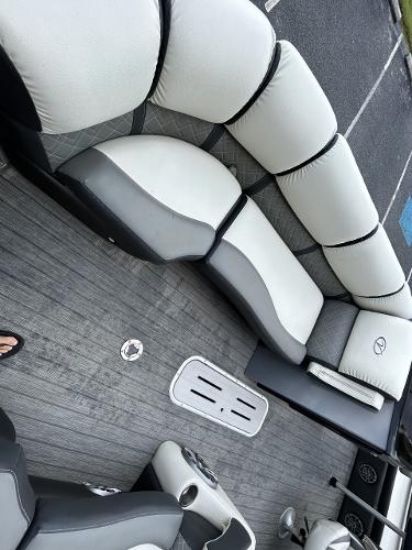 Interior of a 2020 Veranda VP22VLC pontoon boat with gray seating.