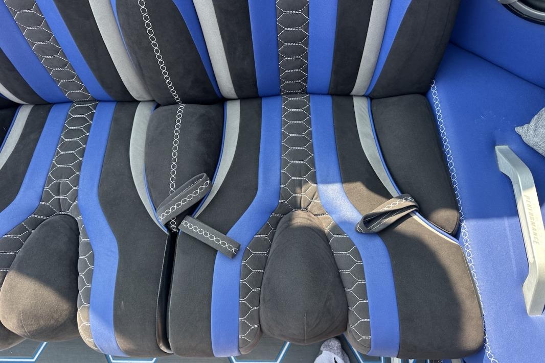 Blue and black boat seats with hexagonal stitching in a 2018 Wright Performance 420.