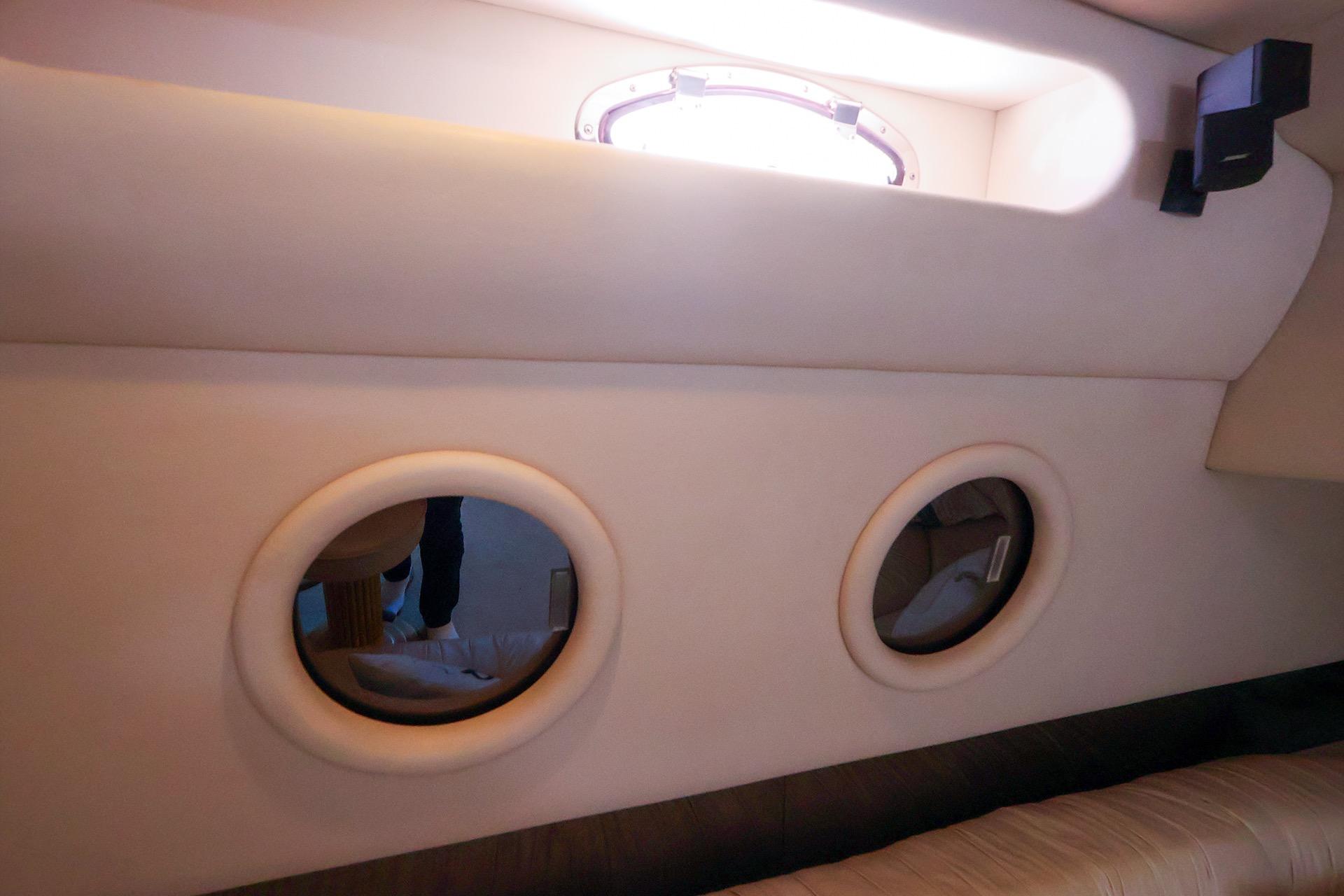 Interior view of 1998 Sea Ray 500 Sundancer yacht with portholes.