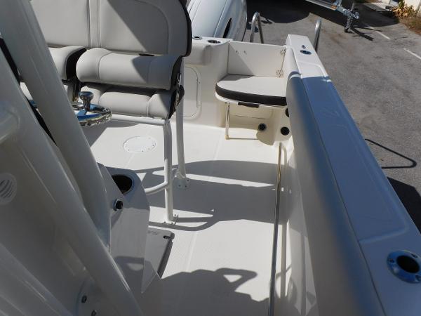 2024 Sailfish 242 CC boat interior with seating and console.