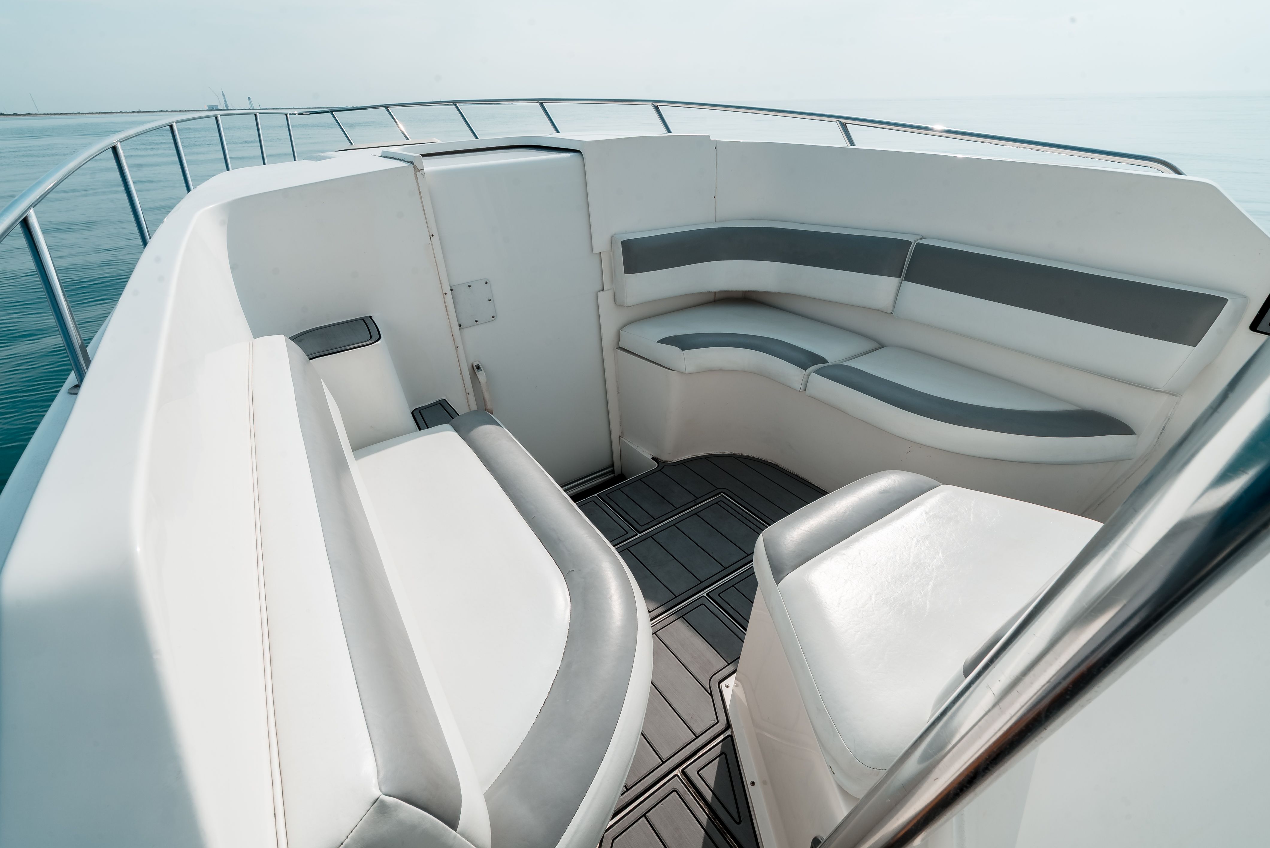 The image shows the cockpit of a 2006 Tempest Offshore 40 boat with gray and white seating.